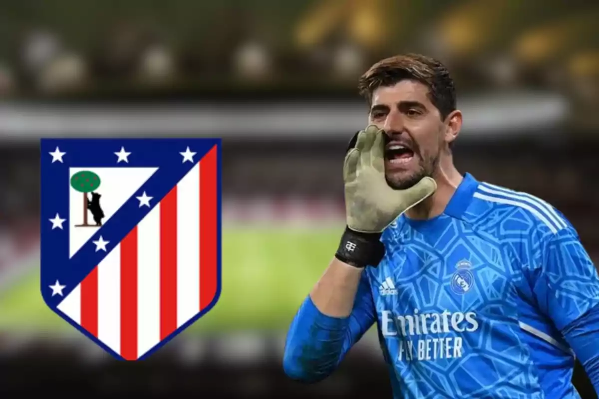 A soccer goalkeeper in a blue uniform shouts as the Atlético de Madrid crest is displayed next to him.