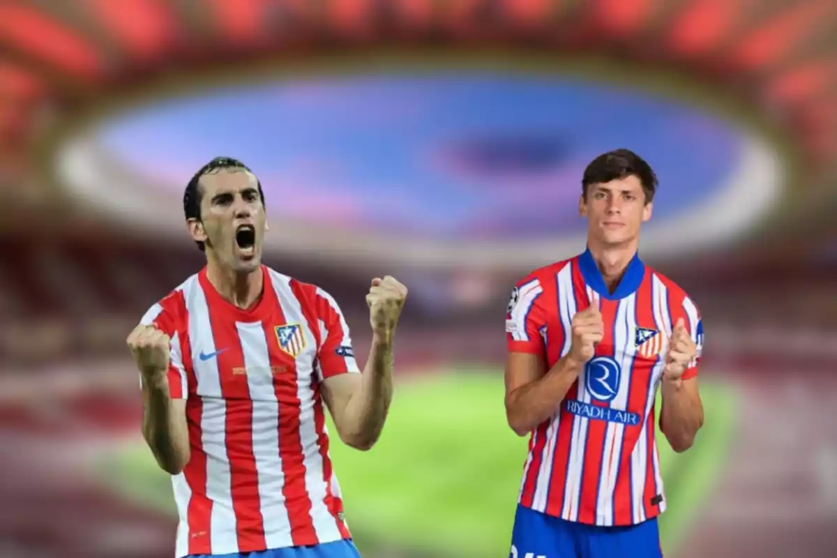 Two football players wearing Atlético de Madrid shirts celebrating in a stadium.