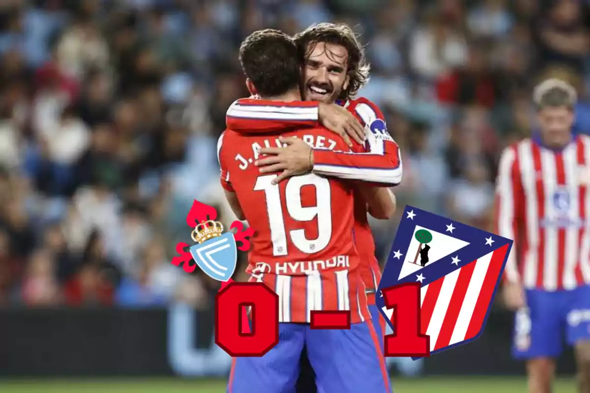 Two Atlético de Madrid players hug each other celebrating a goal, with the final score showing Celta de Vigo 0 - 1 Atlético de Madrid.