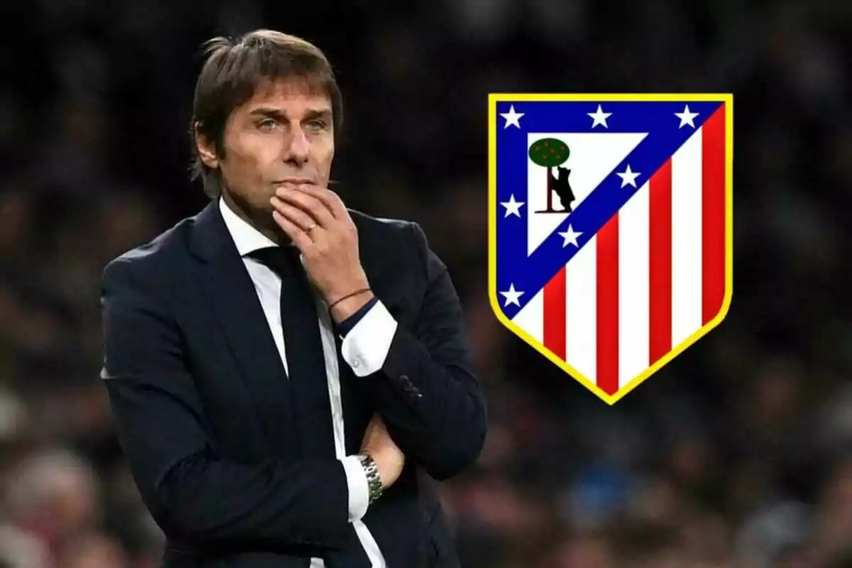 A pensive man in a dark suit and tie, next to the Atlético de Madrid crest.