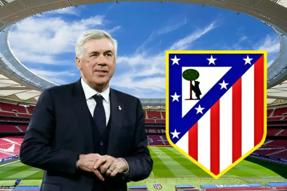 A man in a suit in front of a football stadium with the Atlético de Madrid crest.