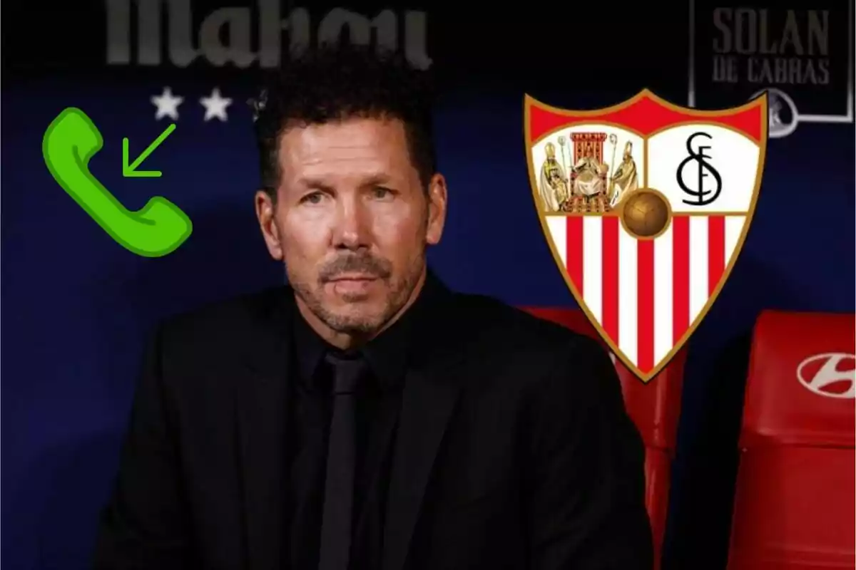 Man in black suit sitting in front of a Sevilla FC crest and a green telephone icon.