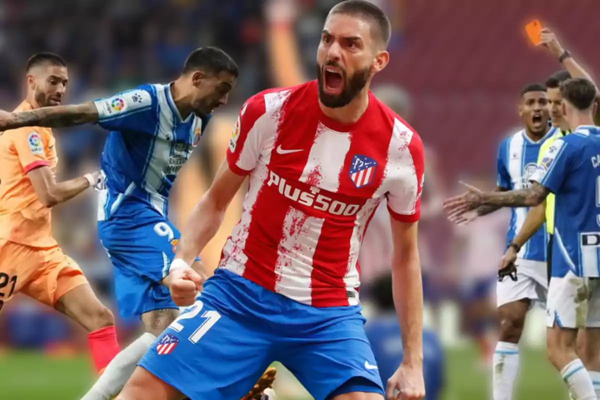 Football players in action during a match, one of them celebrating with the Atlético de Madrid shirt and other players from the opposing team in the background.