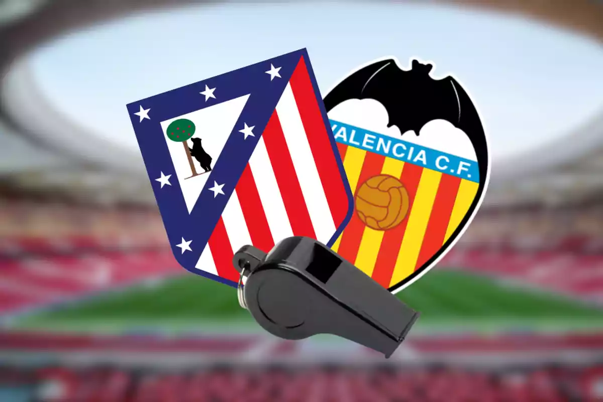 Shields of the football teams Atlético de Madrid and Valencia CF with a whistle in the foreground and a stadium in the background.