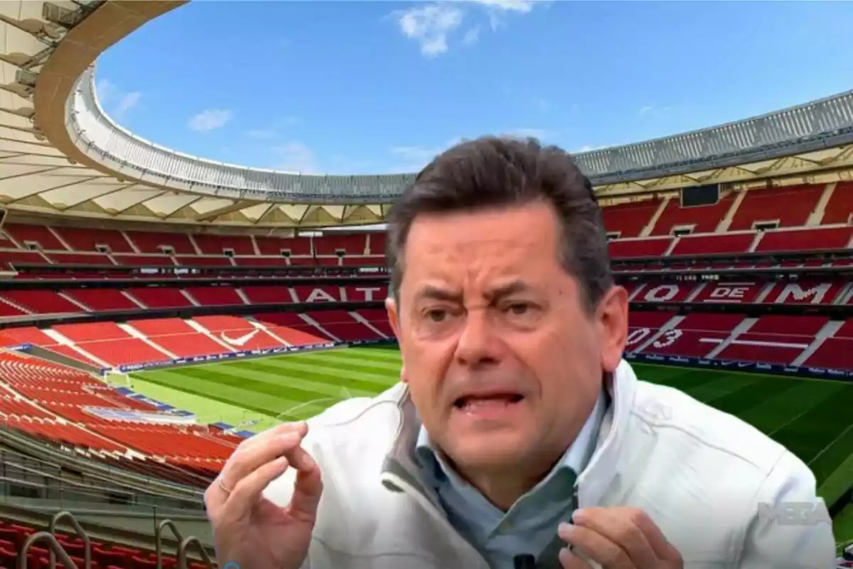 Man talking with an empty football stadium in the background.