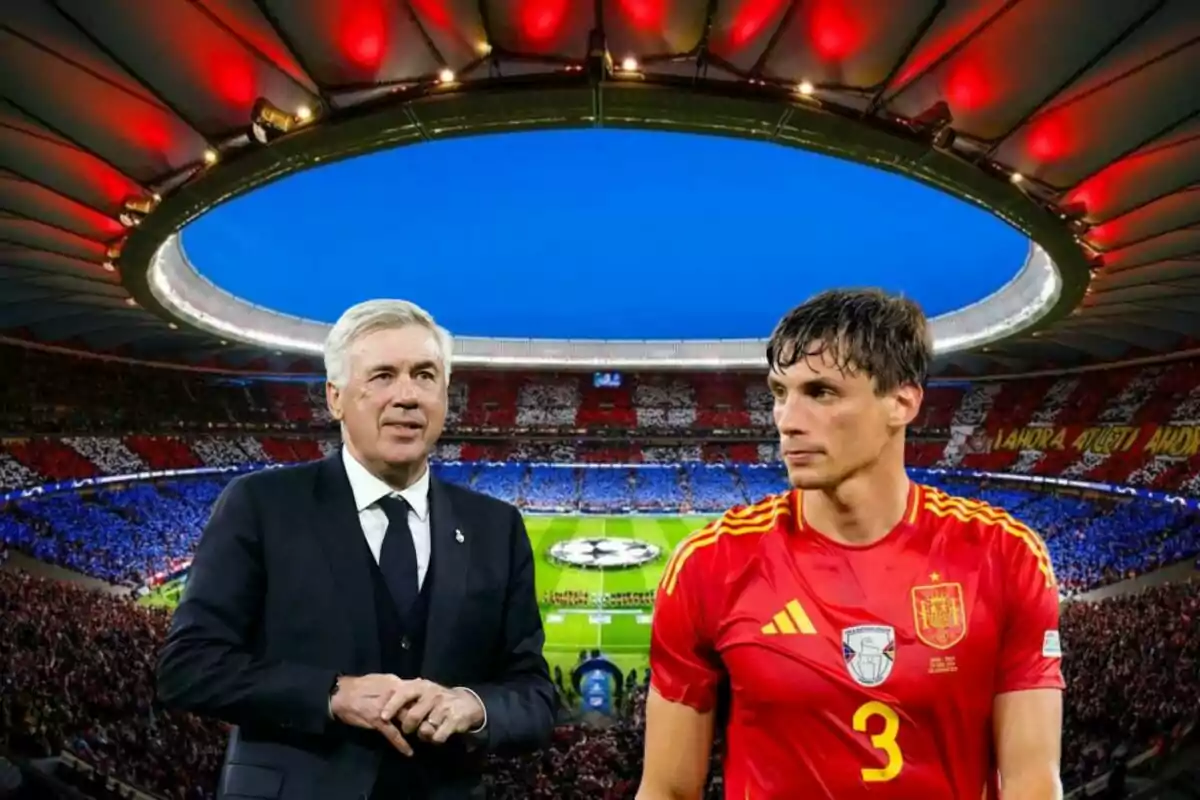 A soccer coach and a player in a red uniform in a stadium full of fans.