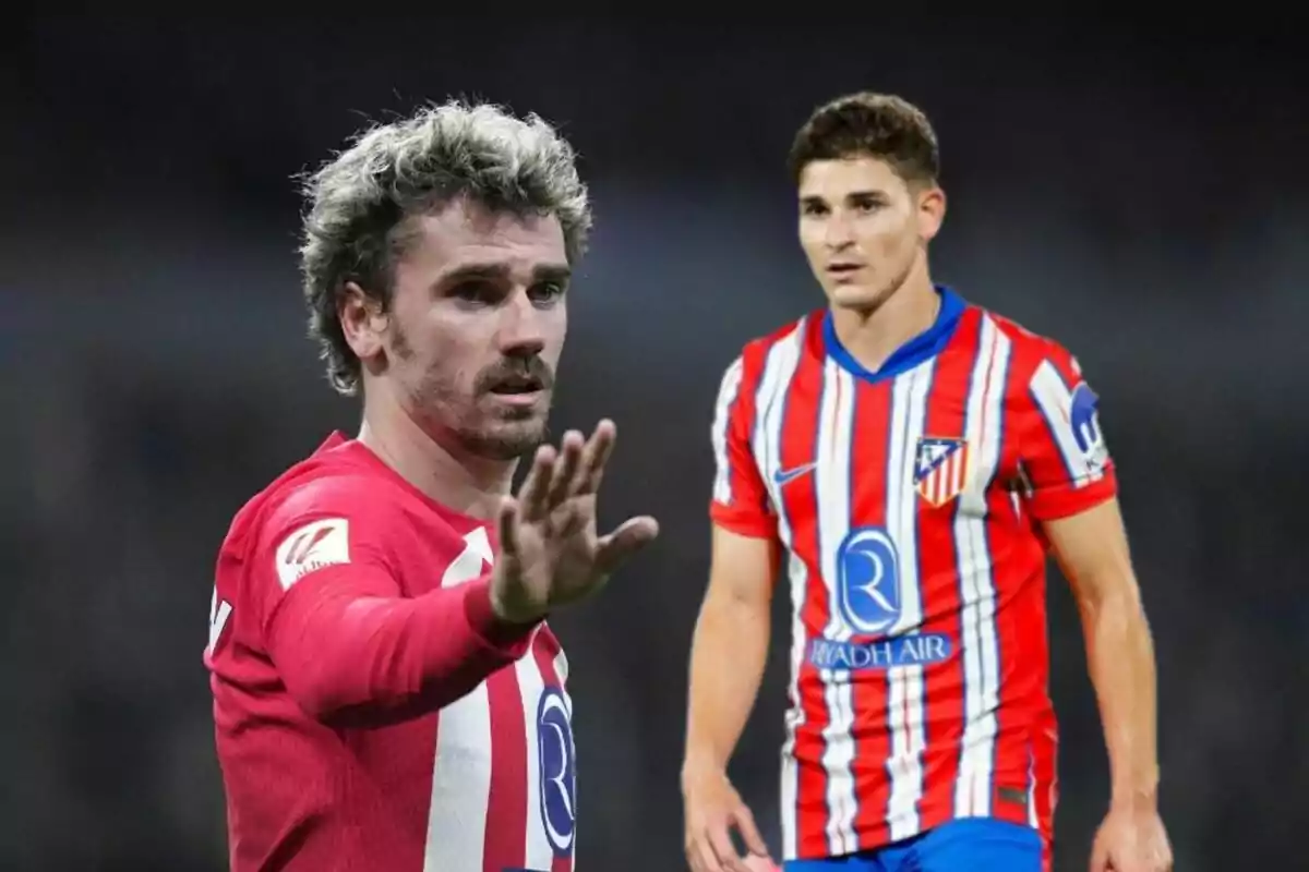 Two football players wearing Atlético de Madrid uniforms, one of them with his hand raised.