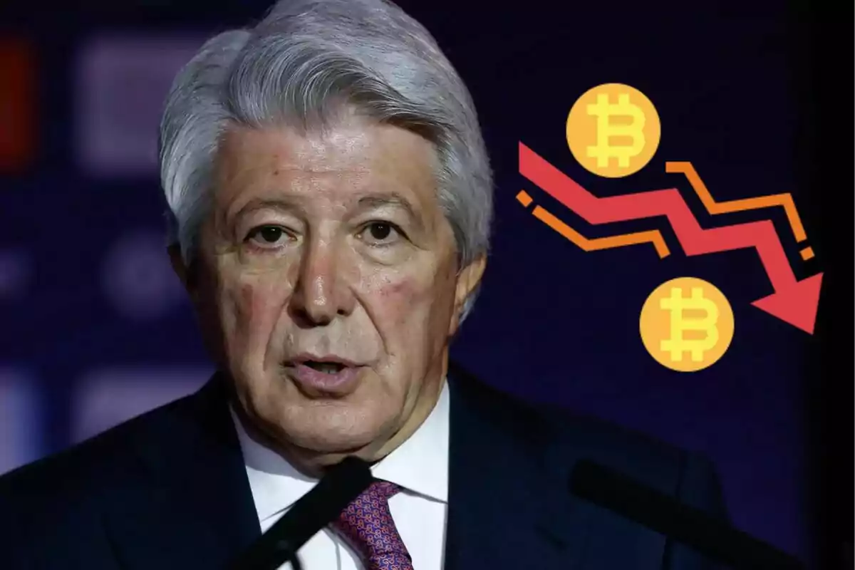 Gray-haired man speaking into a microphone with a falling Bitcoin chart in the background.