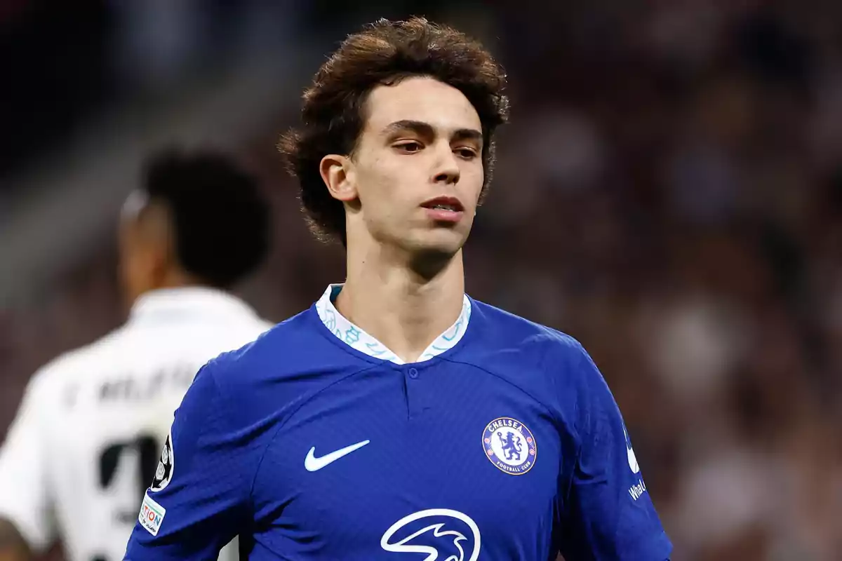 Football player wearing a Chelsea shirt during a match.