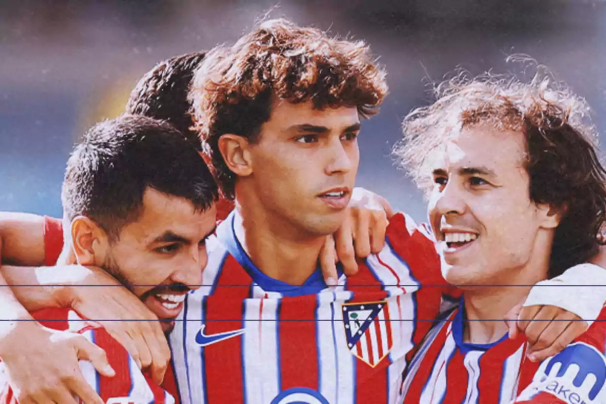 Atlético de Madrid players celebrating a goal together on the pitch.