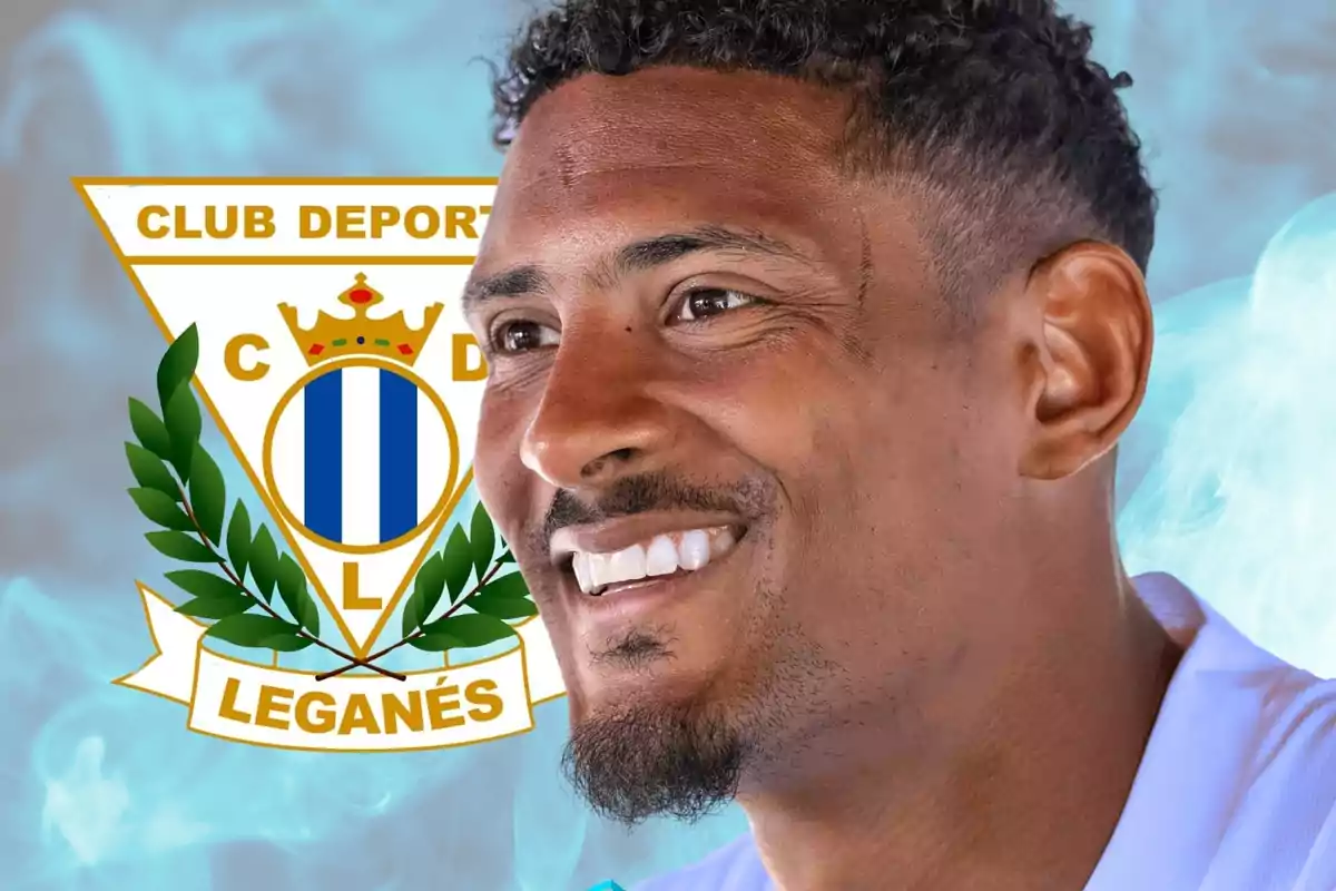 A smiling man with the logo of Club Deportivo Leganés in the background.