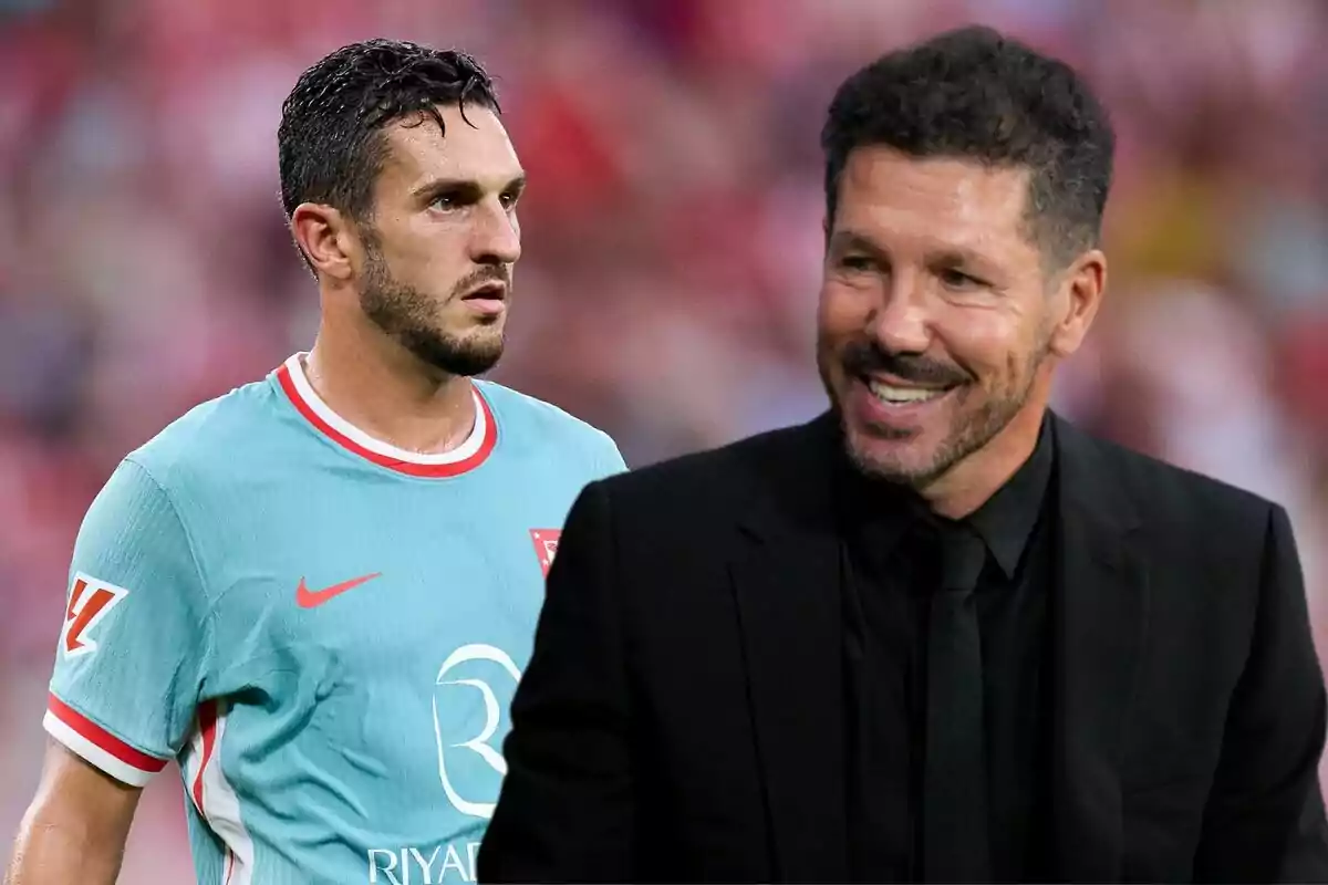 A soccer player in a light blue uniform and a man in a black suit smiling in a stadium.