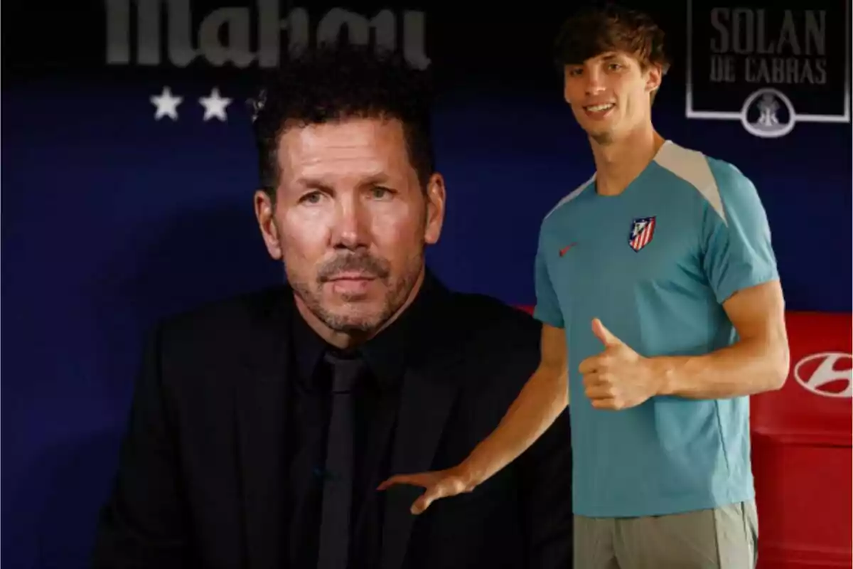 Two men posing, one in a black suit and the other in an Atlético de Madrid sports shirt.