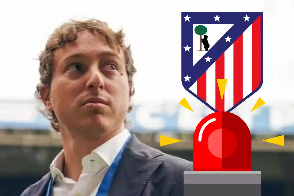 A man in a blue suit and tie looks to the left, next to an Atlético de Madrid crest and a red siren.