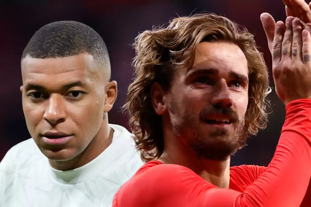 Two soccer players, one in a white shirt and the other in a red shirt, in a stadium.