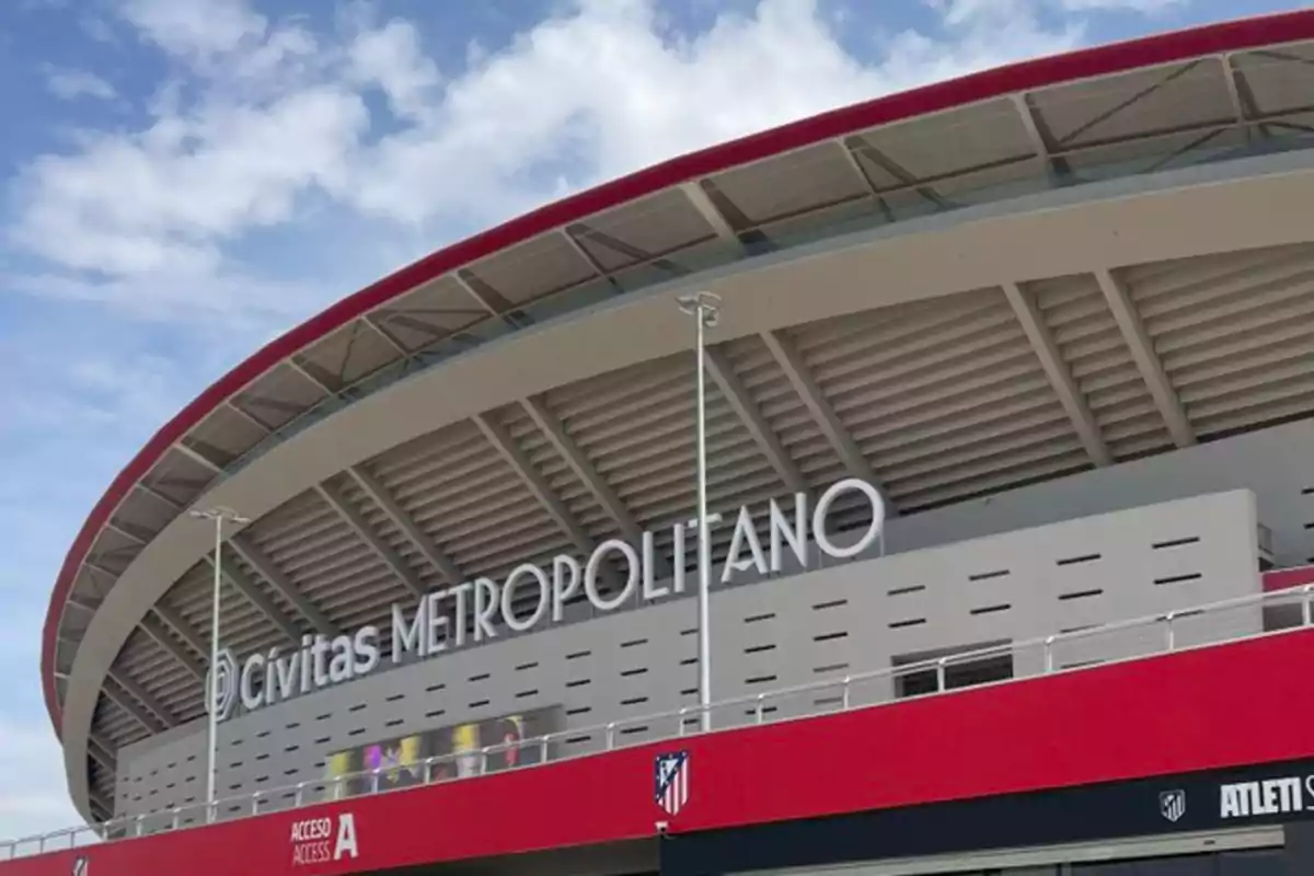 Exterior view of the Cívitas Metropolitano stadium with its distinctive red roof and stadium name sign.