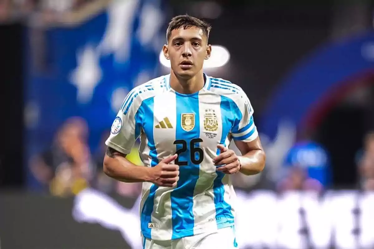 Soccer player with the Argentine national team shirt number 26 in a stadium.