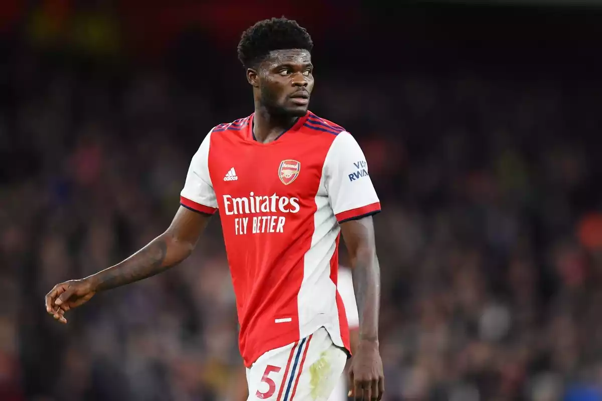 Thomas Partey looking back in the Arsenal shirt