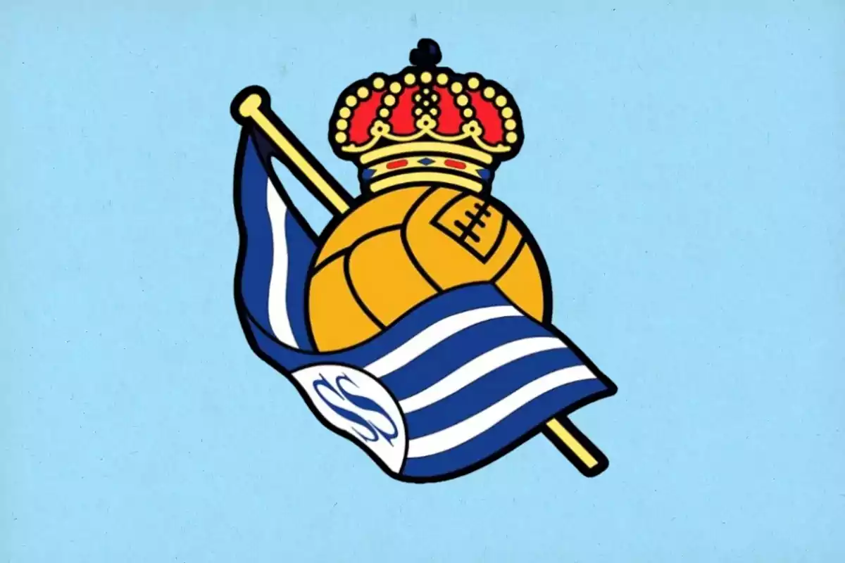 Football team crest with a red and gold crown over a yellow ball and a waving blue and white flag.