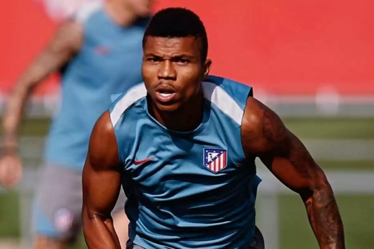 A football player wearing an Atlético de Madrid training shirt during a practice session.