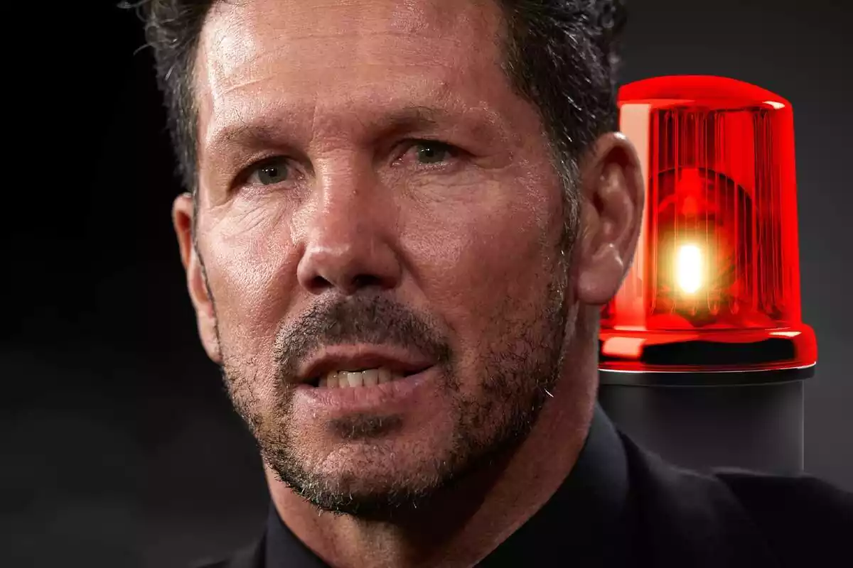 Simeone with an alarm light in the background and with an obvious worried face