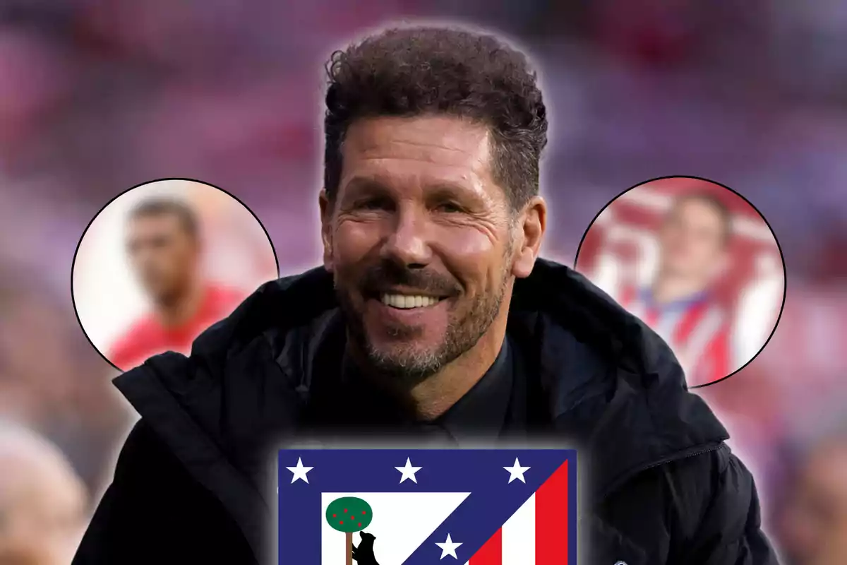 A smiling man with a beard and curly hair, with the Atlético de Madrid crest in the foreground and two blurred figures in the background.