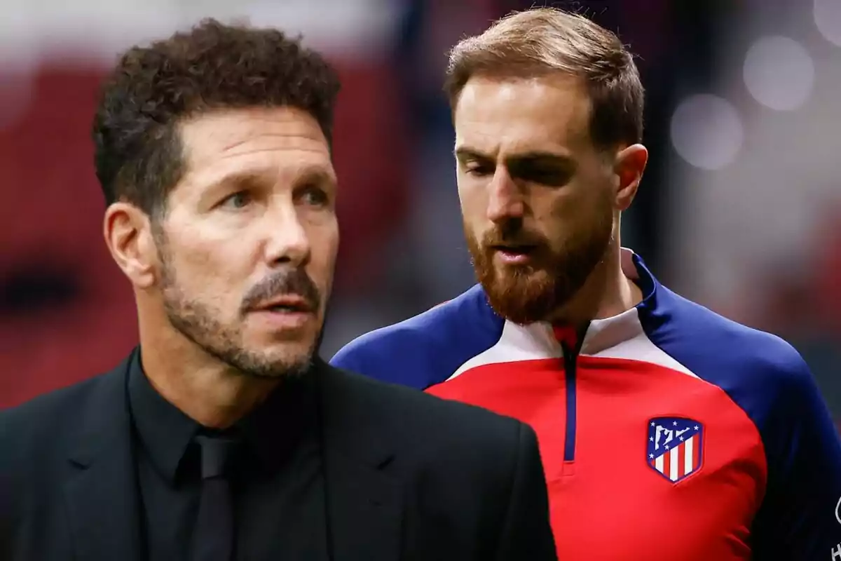 Two men, one in a black suit and the other in an Atlético de Madrid sports uniform, in a stadium.