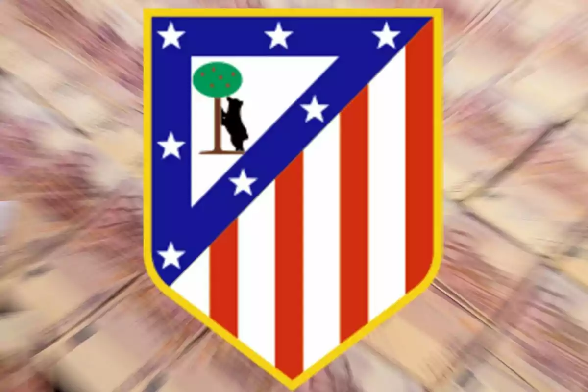 Atlético de Madrid crest on a blurred background.